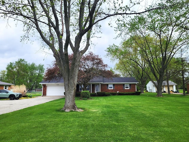 2169 State Route 49, Arcanum, OH 45304 - single story home featuring brick siding, a garage, a front yard, and gravel driveway