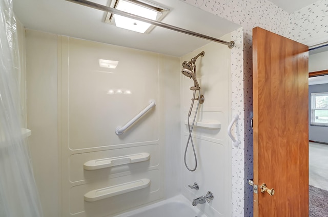 bathroom with shower / bath combination with curtain