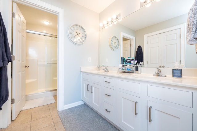 bathroom featuring vanity, tile patterned floors, and a shower with shower door