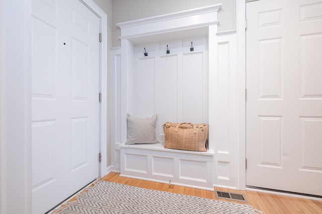 mudroom with light hardwood / wood-style floors