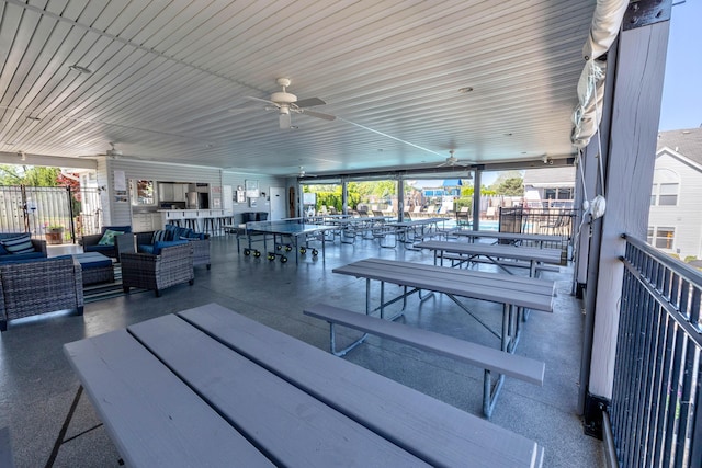 view of patio / terrace with outdoor lounge area, ceiling fan, and a water view