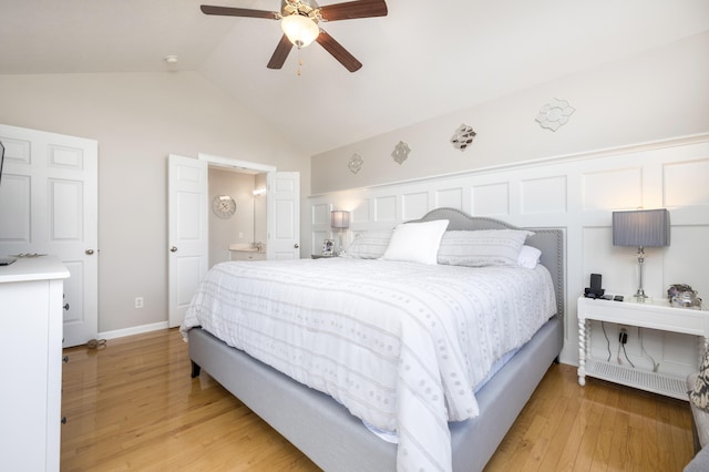 bedroom with vaulted ceiling, ceiling fan, and light hardwood / wood-style flooring