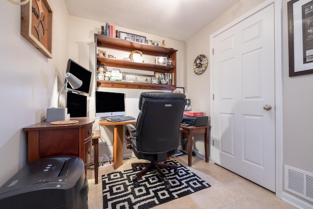 home office with light tile patterned flooring