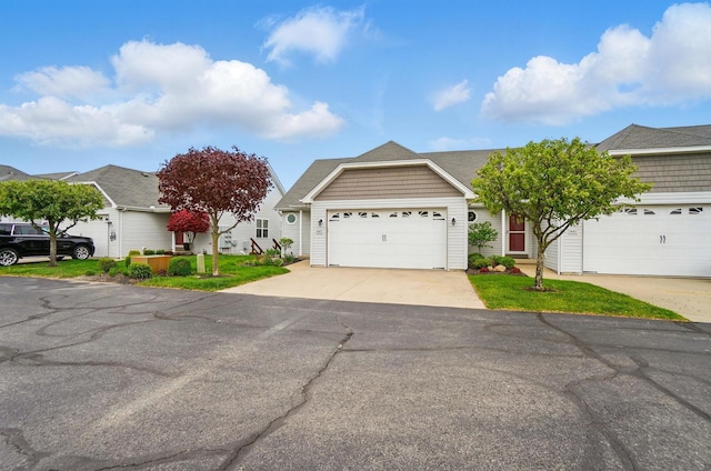 single story home with an attached garage and concrete driveway