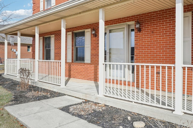 entrance to property featuring covered porch