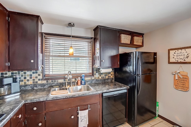 kitchen featuring decorative light fixtures, sink, decorative backsplash, and black appliances