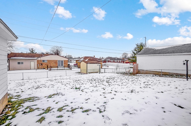 view of yard layered in snow