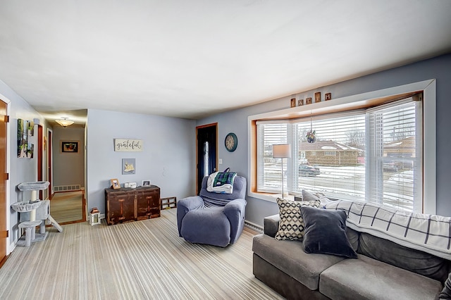 living room featuring carpet floors and plenty of natural light