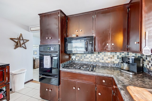 kitchen featuring light tile patterned floors, decorative backsplash, and black appliances