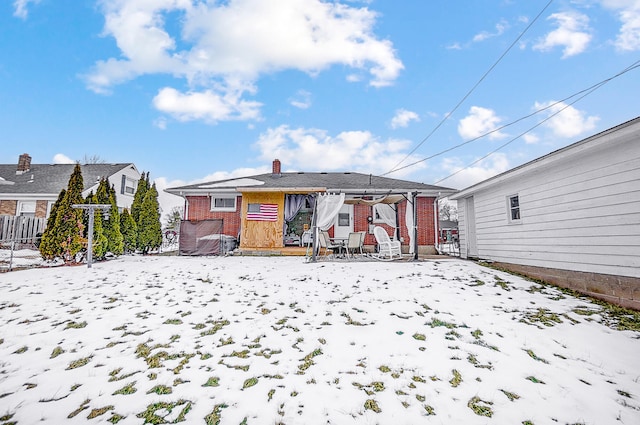 view of snow covered house