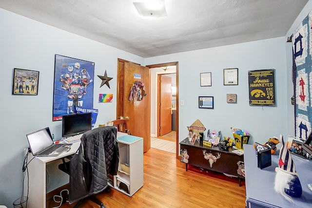 office area with hardwood / wood-style flooring