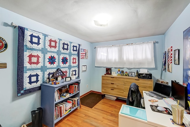 office with light hardwood / wood-style floors