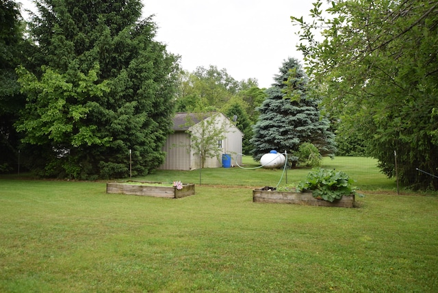 3756 Storms Creek Rd, Urbana, OH 43078 - view of green lawn featuring a garden
