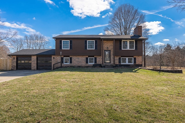 raised ranch featuring a garage, fence, concrete driveway, a front lawn, and a chimney