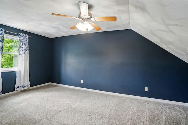 1370 Carpenter Rd, Bellbrook, OH 45305 - spare room featuring carpet flooring, ceiling fan, baseboards, and lofted ceiling