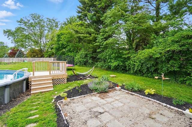 1370 Carpenter Rd, Bellbrook, OH 45305 - view of yard featuring a wooden deck and an outdoor pool
