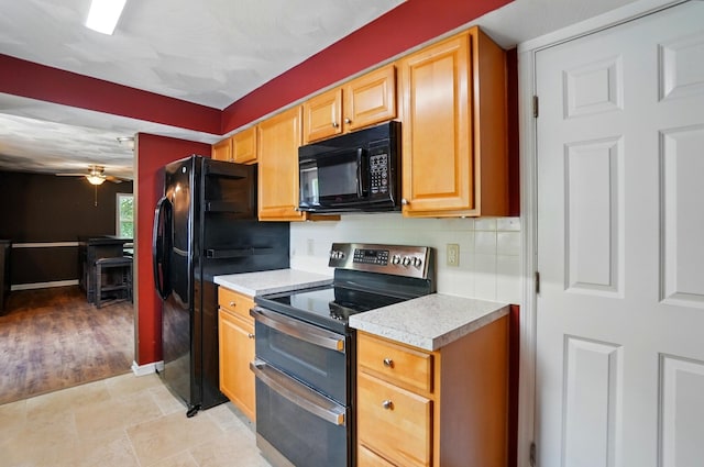 1370 Carpenter Rd, Bellbrook, OH 45305 - kitchen with black appliances, light countertops, ceiling fan, decorative backsplash, and baseboards