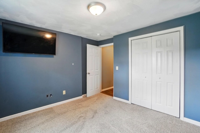 1370 Carpenter Rd, Bellbrook, OH 45305 - unfurnished bedroom with carpet floors, baseboards, and a closet