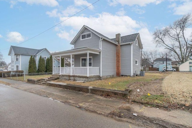 view of front of home with central air condition unit and a porch