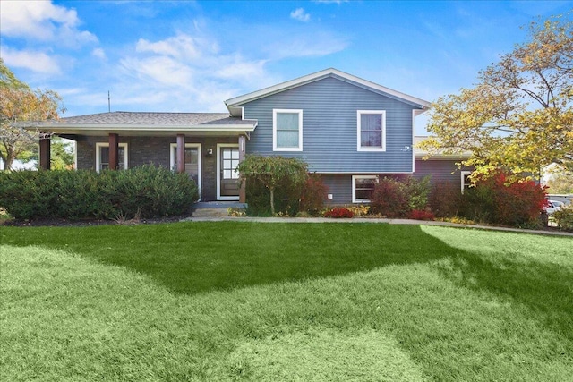 split level home with a front yard