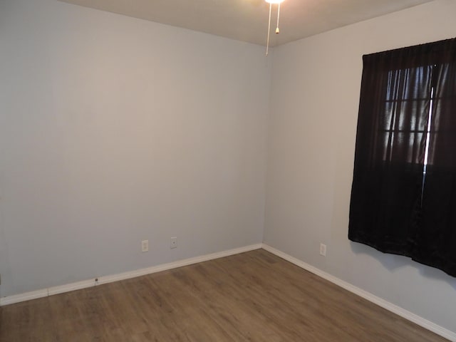 421 Summit St, Sidney, OH 45365 - spare room with baseboards and wood finished floors
