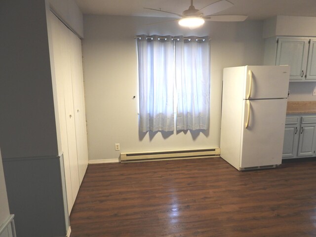 421 Summit St, Sidney, OH 45365 - interior space featuring ceiling fan, dark wood-type flooring, freestanding refrigerator, and a baseboard radiator