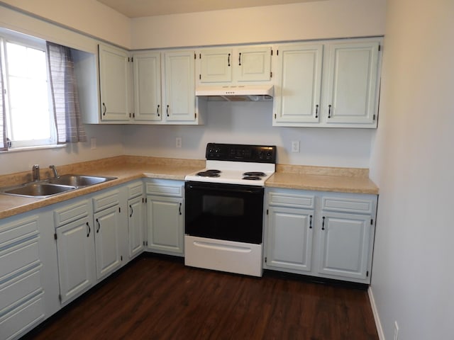 421 Summit St, Sidney, OH 45365 - kitchen featuring a sink, under cabinet range hood, light countertops, electric range, and dark wood-style flooring