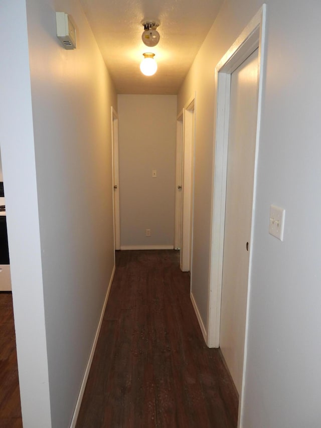 421 Summit St, Sidney, OH 45365 - hallway featuring baseboards and wood finished floors