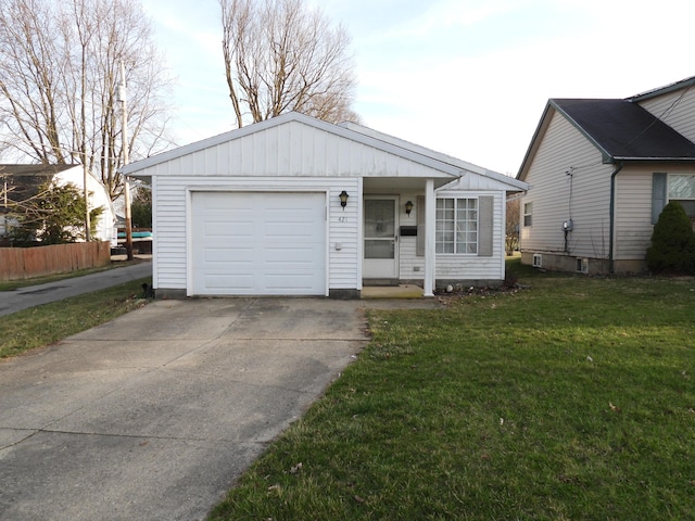 421 Summit St, Sidney, OH 45365 - view of front facade with a front lawn, concrete driveway, and fence