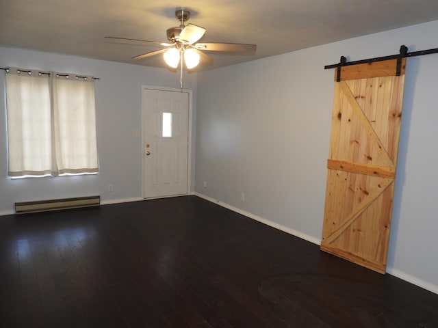 421 Summit St, Sidney, OH 45365 - entryway with baseboards, dark wood finished floors, a barn door, a ceiling fan, and a baseboard radiator