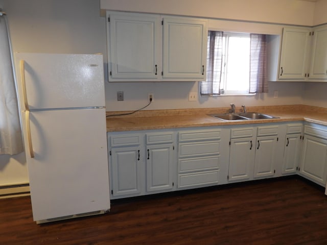 421 Summit St, Sidney, OH 45365 - kitchen with a sink, light countertops, dark wood-style flooring, and freestanding refrigerator