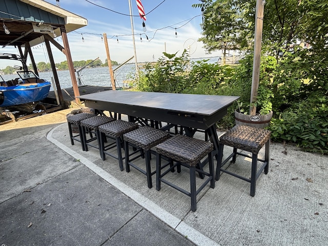 9029 Maple St, Huntsville, OH 43324 - view of patio with a water view and outdoor dining space