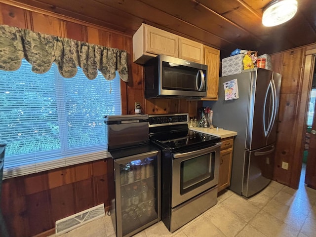 9029 Maple St, Huntsville, OH 43324 - kitchen with appliances with stainless steel finishes, light countertops, and light tile patterned floors