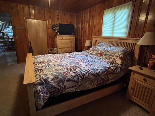 9029 Maple St, Huntsville, OH 43324 - bedroom with wood walls, wood ceiling, and carpet floors