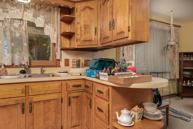 106 Westview Dr, Arcanum, OH 45304 - kitchen featuring a sink, light countertops, brown cabinetry, and open shelves