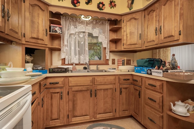 106 Westview Dr, Arcanum, OH 45304 - kitchen featuring open shelves, a sink, light countertops, and brown cabinetry