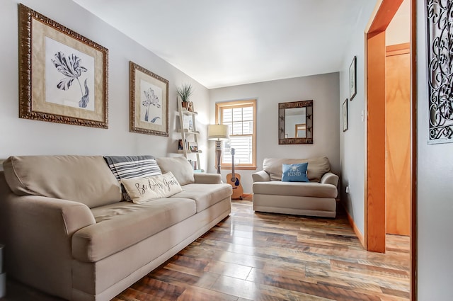 living room with baseboards and wood finished floors