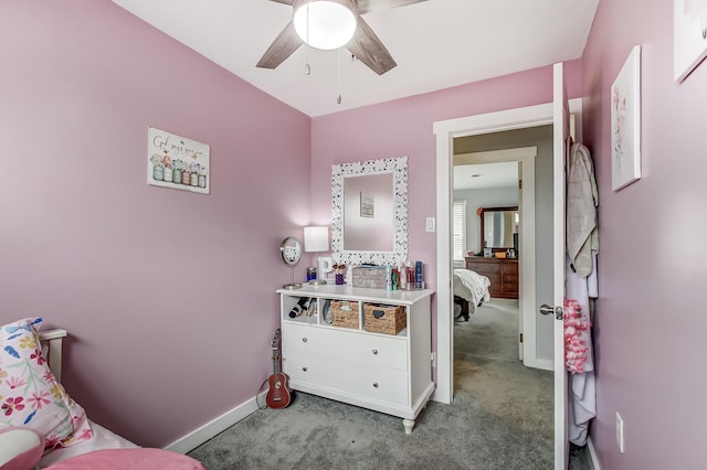 carpeted bedroom with baseboards and a ceiling fan