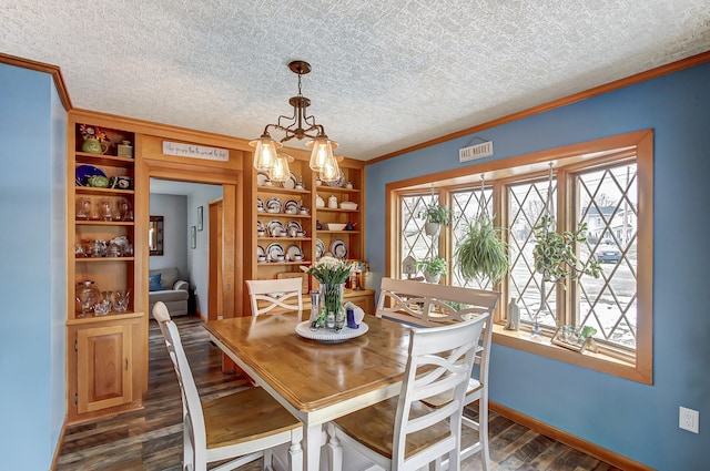 dining room featuring a textured ceiling, visible vents, baseboards, dark wood finished floors, and crown molding