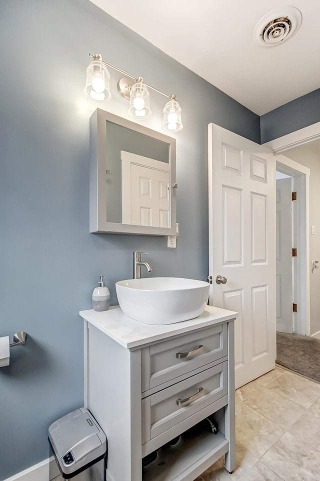 bathroom with vanity and visible vents