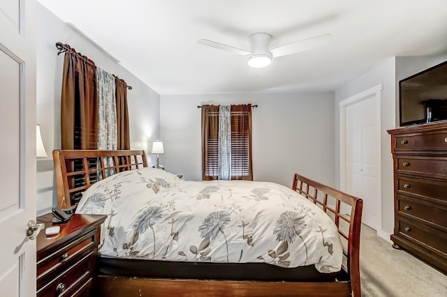 carpeted bedroom featuring a ceiling fan