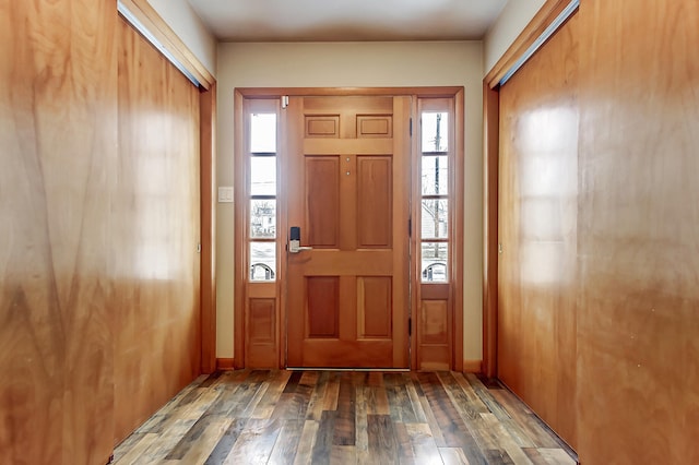 entryway featuring wood-type flooring and baseboards