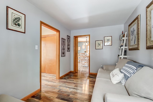 living room with light wood-style flooring and baseboards