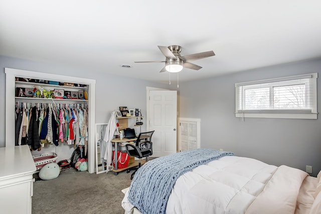 carpeted bedroom featuring visible vents, a closet, and a ceiling fan