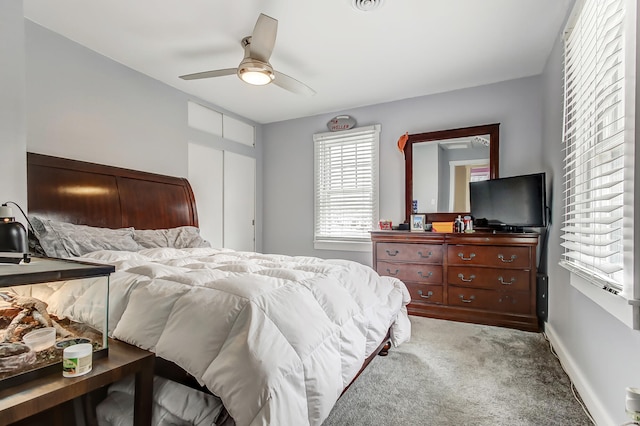 bedroom featuring carpet, baseboards, and ceiling fan