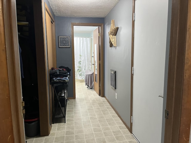 320 E Anthony St, Celina, OH 45822 - corridor featuring a textured ceiling and baseboards