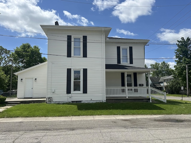 301 Plumvalley St, Bellefontaine, OH 43311 - view of front of property with a porch and a front lawn