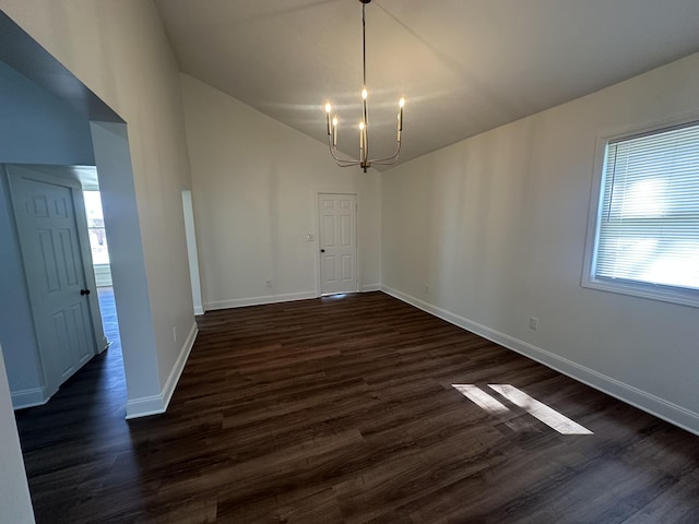 301 Plumvalley St, Bellefontaine, OH 43311 - unfurnished dining area with dark wood-type flooring, a chandelier, and baseboards