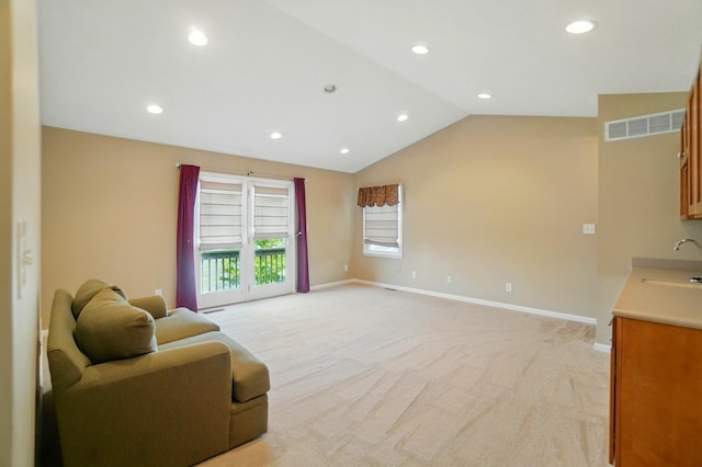 9113 Lake Ave, Huntsville, OH 43324 - living room with light colored carpet, recessed lighting, and vaulted ceiling