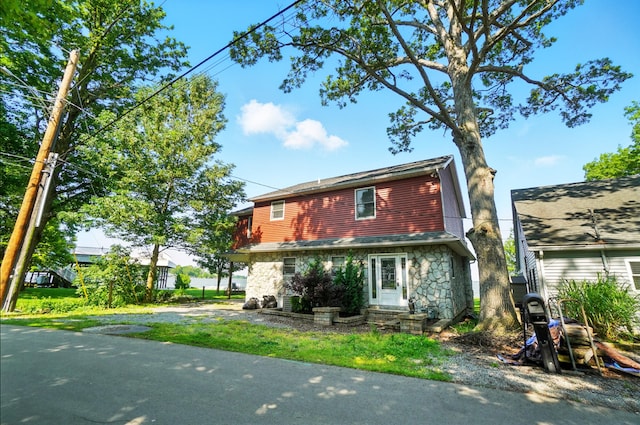 9113 Lake Ave, Huntsville, OH 43324 - view of front facade with stone siding